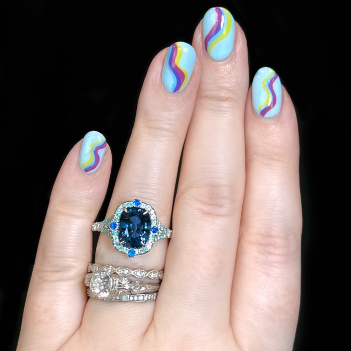 Spinel engagement ring by Omi Prive. With 3.11 ct cushion-cut cobalt blue Spinel, accented with Hauyne, Paraiba Tourmaline, and diamonds. Seen at AGTA's 2022 Spectrum Awards.